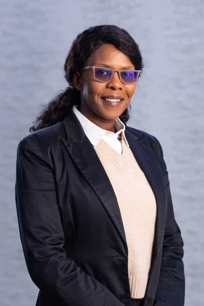 Woman in blazer and sweater vest